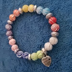 Handcrafted bracelet, approximately 8 inches. Multi colors with silver accents.